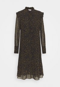 Svart klänning i genomskinligt tyg, leopardmönster i gyllene toner, volangkrage, långa ärmar och en flödande silhuett.