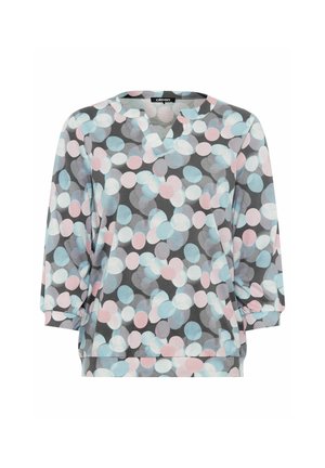 Grijze pullover met een V-hals en 3/4 mouwen. Heeft een patroon van grote, overlappende cirkels in lichtblauw en roze. Zachte stoftextuur.