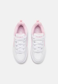 White sneakers with pink accents, featuring lace-up design, rounded toes, and textured surfaces. Logo on tongue and side. Soft padded collar.
