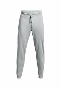 Světle šedé jogger kalhoty s elastickým pasem, šňůrkou na stažení a manžetami na koncích. Hladká tkanina s jemným logem na levém stehně.
