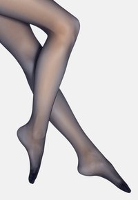 Durchsichtige schwarze Strumpfhosen mit glatter Textur, die subtil mit dem Hautton verschmelzen, ausgestattet mit einer verstärkten Zehenpartie und nahtlosem Design.