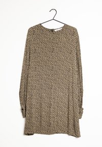 Tunique à manches longues en tissu foncé à motifs, avec des motifs crème et beige. Encolure ronde avec une ouverture en forme de goutte d'eau dans le dos.