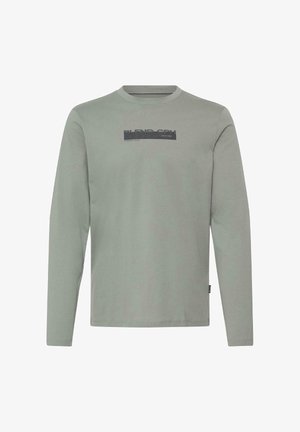 Lichtgrijs shirt met lange mouwen en ronde hals, met "BLEND CPH" en kleine tekst in zwart gedrukt op de borst, effen voorkant.