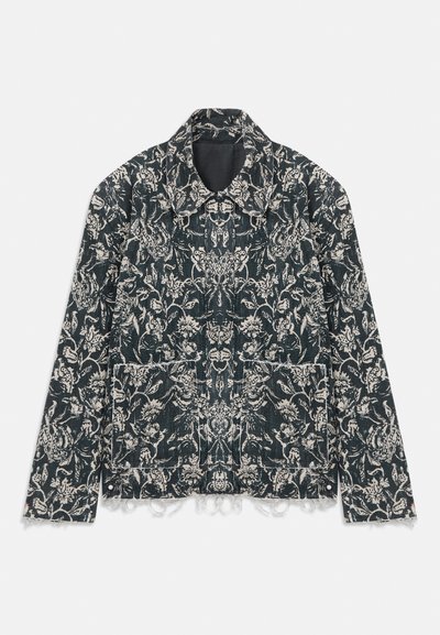 Floral-patterned jacket in dark blue fabric with white designs. Features a classic collar, two front pockets, and frayed hem details.