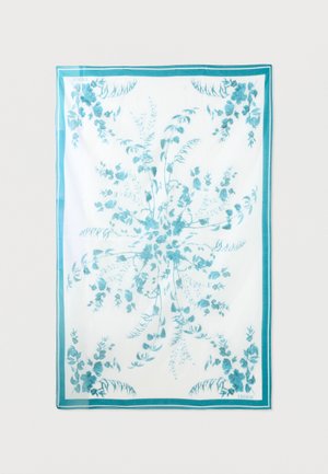 Biely obdĺžnikový šál s tyrkysovými kvetinovými vetvičkami a zodpovedajúcim tyrkysovým lemom.