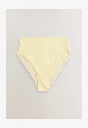 Gelbe Baumwollunterwäsche mit gewelltem Spitzenrand entlang der Kanten. Glatte Textur, mittel-hoher Schnitt und vollständige Abdeckung.