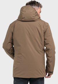 Brown waterproof jacket with a hood, featuring a smooth texture and a longer back hem. Includes adjustable cuffs and minimalistic design.