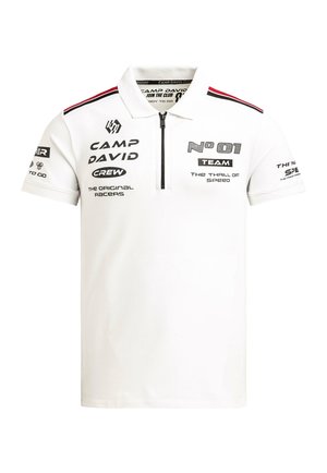 White short-sleeve polo with black zipper, red and black shoulder stripes, and black printed text logos including "Camp David" and "No 01 Team".