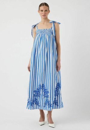 Abito lungo a righe blu e bianche con top arricciato, spalline legate e ricami floreali all'orlo. Tessuto in cotone morbido.