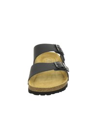 Black synthetic slide sandal with two adjustable straps, cork footbed, and rubber sole. The interior has a soft, light brown texture.