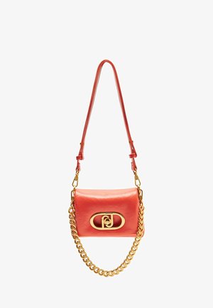 Coral leather crossbody bag with a gold chain strap and a gold logo clasp. Features a smooth texture and a rectangular shape.