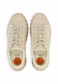 Beige suede sneakers with flat laces, rubber outsole, and circular logo on insole. Features textured upper and padded collar.