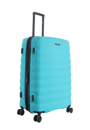 Turquoise hard-shell suitcase with four spinner wheels and an extended black telescopic handle.