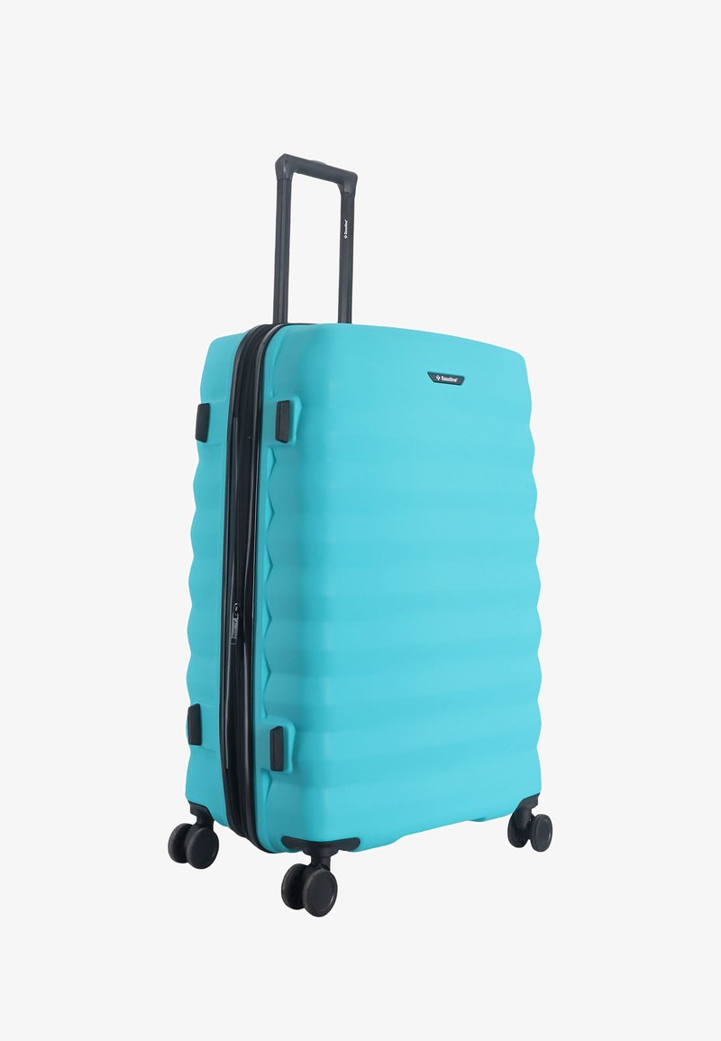 Turquoise hard-shell suitcase with four spinner wheels and an extended black telescopic handle.