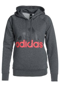 Sweat à capuche Adidas gris foncé avec logo noir et grand texte rouge « adidas » à l'avant, avec capuche et cordons.