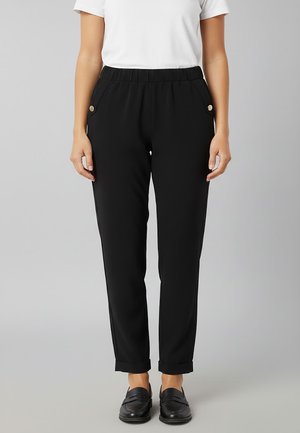 CON RISVOLTO - Pantaloni - nero