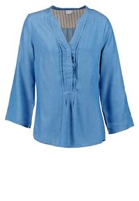 Jasnoniebieska bluzka denimowa z dekoltem w kształcie litery V, długimi rękawami, szczegółowymi fałdami z przodu i podszewką w kropki. Gładka tekstura, luźny krój.