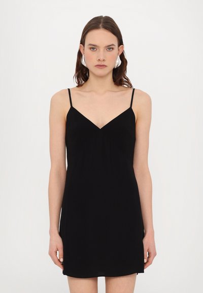 Black sleeveless dress with a V-neckline, soft fabric, and a relaxed fit. Features thin straps and a slightly flared hem.