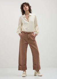 Calliope CON FUSCIACCA  - Jeans a zampa - beige
