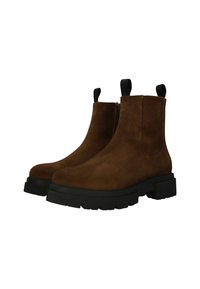 Botines de ante marrón con tacón de bloque, que cuentan con una cremallera lateral y pestañas de agarre, suela de goma texturizada y diseño estilizado.