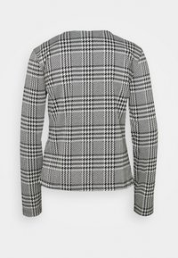 Dámská sako s černo-bílým kostkovaným vzorem houndstooth, přiléhavý střih, dlouhé rukávy, kulatý výstřih, hladká textura, nezapnutá zadní část.