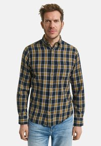 Marineblauw en gele geruite overhemd met een button-down kraag en een borstzak. Lange mouwen en een gebogen zoom, gemaakt van zachte, gestructureerde stof.