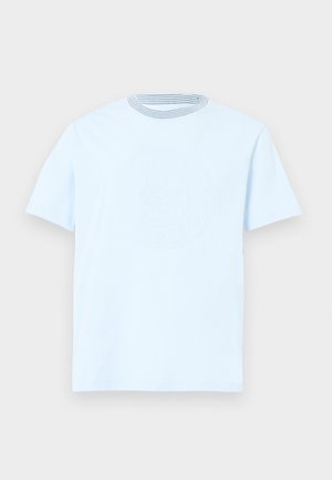 Light blue cotton T-shirt featuring short sleeves, a round neck with a striped pattern, and a textured logo design on the front.