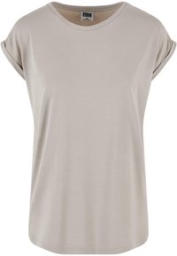 Lys beige kortærmet T-shirt med rund hals og opsmøgede ærmer. Blød tekstur og en afslappet pasform, med en lige bundkant.