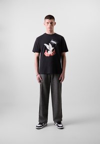 Puma RELAXED TRACK PANTS - Trainingsbroek - black/alpine snow
