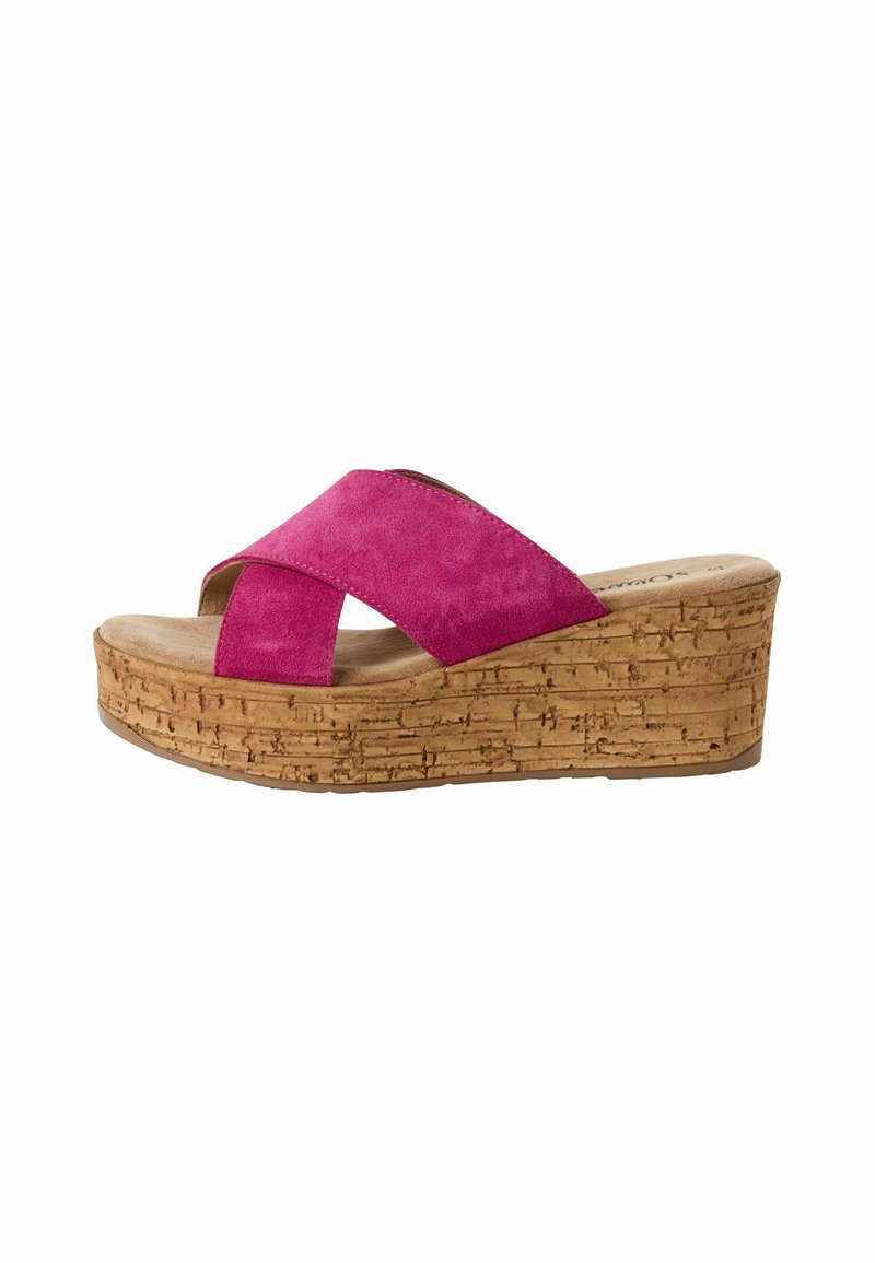 Pink suede wedge sandal with crossover straps, cork platform, and textured detailing on the sole. Open-toe design.