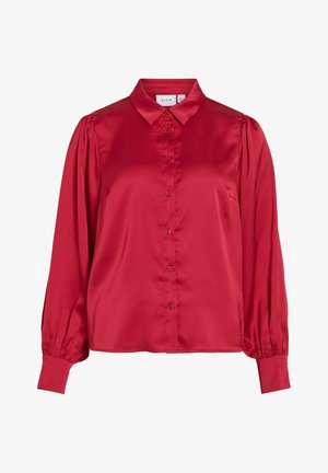 Rote Satin-Bluse mit langen Ärmeln, gepufften Schultern, durchgehender Knopfleiste, spitzem Kragen und taillierten Manschetten.