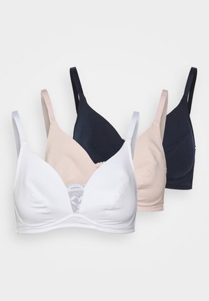 Three wireless bras in white, nude, and navy. Features smooth fabric with lace detailing at the center and adjustable straps.