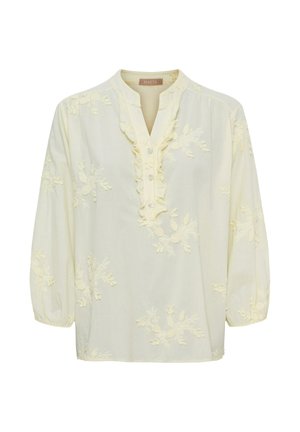 Cremefarvet bluse med lange ærmer, blomsterbroderi, flæset V-udskæring og tre knapper foran.