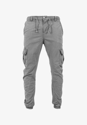 Sive cargo hlače z elastičnim pasom, vrvico, stranskimi žepi in elastičnimi manšetami. Narejene iz lahke tkanine z gladko teksturo.