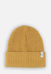 Bonnet en tricot couleur moutarde avec un ourlet à côtes. Présente un motif texturé et une petite étiquette en tissu sur le côté. Matière douce.
