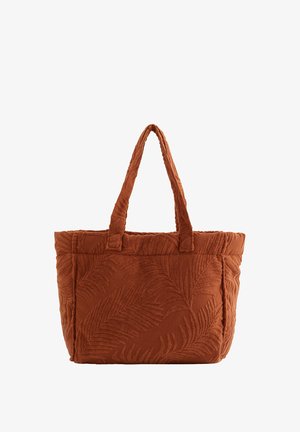 Sac fourre-tout couleur rouille avec motif texturé de feuille de palmier et deux poignées, tissu doux avec structure rembourrée.