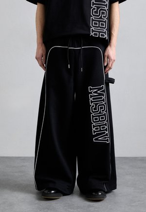 SPRING BREAKERS  - Tracksuit bottoms - black