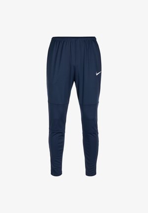 Pantalons de sport bleu marine avec une taille élastique, des jambes fuselées et un petit logo Nike blanc sur la cuisse supérieure. Matière lisse.