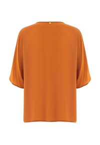 Kurzärmlige, orange Bluse aus glattem Stoff. Mit einem runden Halsausschnitt und einem geraden Saum, sowie einem kleinen Etikett auf der Rückseite.
