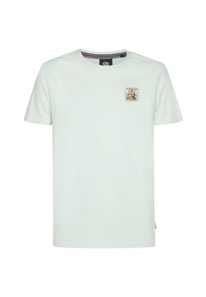 Hellminzgrünes T-Shirt mit kurzen Ärmeln aus Baumwolle. Es verfügt über einen kleinen grafischen Aufnäher auf der linken Brustseite und einen runden Halsauschnitt.