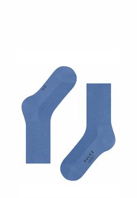 Chaussettes en coton bleu avec texture côtelée, dotées d'un talon et d'un orteil renforcés, et d'un logo au niveau de la cheville. Convient pour une utilisation décontractée.