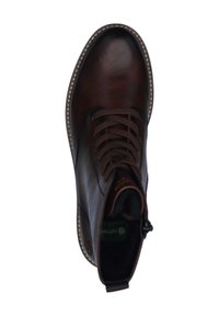 Bottine en cuir marron avec bout arrondi, surface texturée et semelle blanche cousue. Dotée de lacets marron et d'une fermeture éclair sur le côté.
