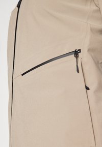 Peak Performance COMMUTER HIPE  - Impermeabile - avid beige/black
