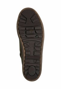 Brown rubber shoe sole with textured tread. Features "soft" and "FLEX" imprints. Contoured design with varying depths for grip and flexibility.