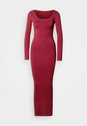 Long-sleeve, form-fitting dress in deep red, featuring a wide scoop neckline and ribbed texture, extending to the ankle.