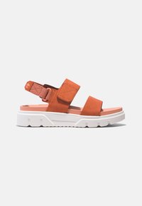 Orange suede sandals with a white chunky sole, featuring two wide straps and a rear adjustable buckle for fit customization.