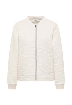 Cremefarbige Bomberjacke mit gerippter Struktur, ausgestattet mit Reißverschluss, zwei Seitentaschen und Bündchen aus weichem Strickmaterial.