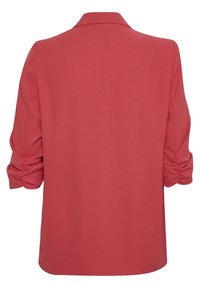 Blusa rossa leggera con colletto, maniche a 3/4 e dettagli arricciati ai polsini. Tessuto morbido e taglio rilassato.