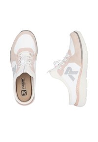 White and light pink sneakers with a smooth synthetic upper, textured accents, and a cushioned outsole, featuring a logo on the side.