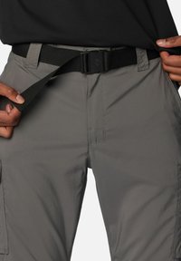 Gray cargo pants with a smooth texture, featuring a black adjustable belt with a rectangular buckle. Pockets visible on the sides.